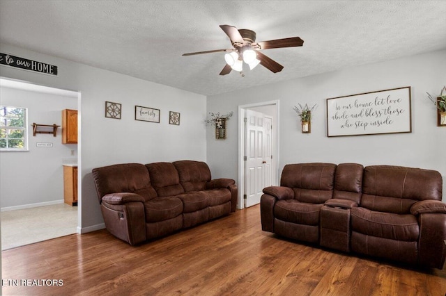 340 Mountain View Ests, Caryville, TN 37714 - living area featuring ceiling fan, wood finished floors, a textured ceiling, and baseboards