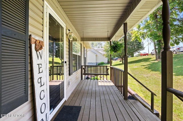 340 Mountain View Ests, Caryville, TN 37714 - wooden porch featuring a lawn