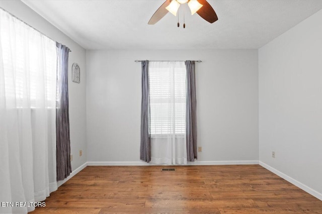 340 Mountain View Ests, Caryville, TN 37714 - unfurnished room featuring wood finished floors, a ceiling fan, and baseboards