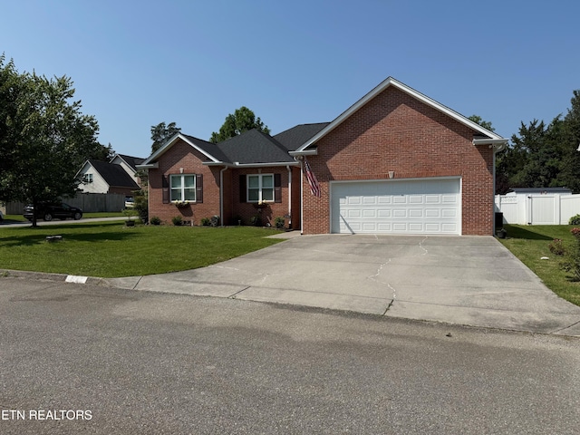 7243 Autumn View Ln, Powell, TN 37849 - view of front of house featuring brick siding, concrete driveway, and an attached garage
