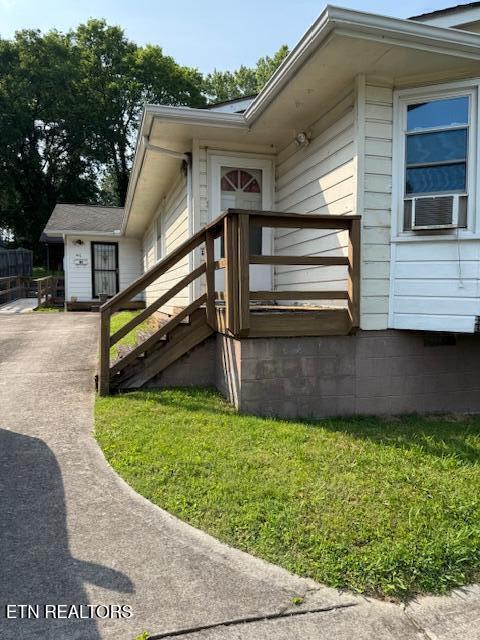 805 Sewanee St, Harriman, TN 37748 - property entrance with cooling unit and a yard