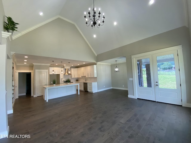 8017 Little Joe Rd, Powell, TN 37849 - unfurnished living room featuring a chandelier, baseboards, high vaulted ceiling, crown molding, and dark wood-style flooring