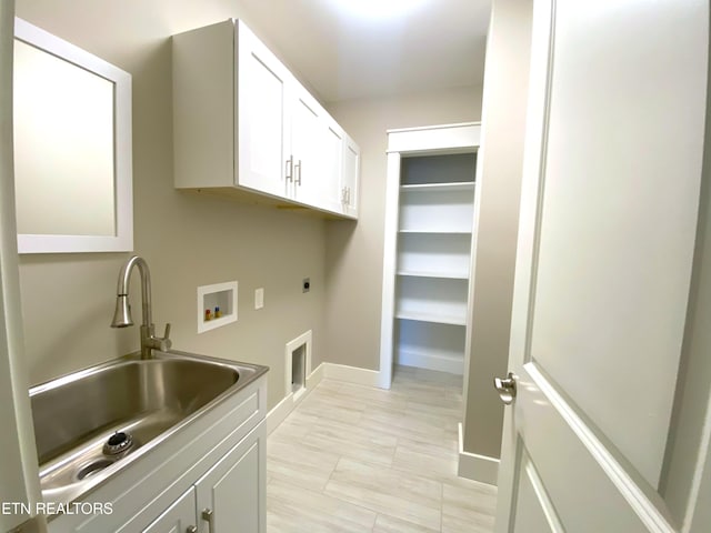 8017 Little Joe Rd, Powell, TN 37849 - laundry room with electric dryer hookup, washer hookup, cabinet space, and baseboards