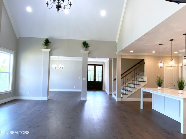 8017 Little Joe Rd, Powell, TN 37849 - foyer with a chandelier, baseboards, crown molding, stairs, and dark wood-type flooring
