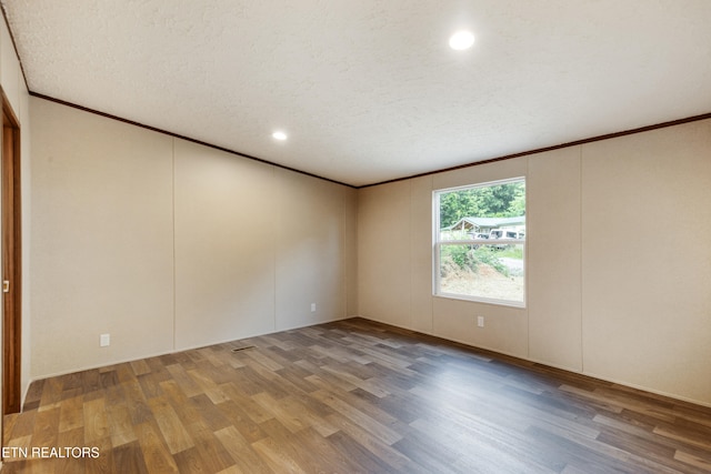 1527 Black Oak Dr, Sevierville, TN 37876 - unfurnished room with wood finished floors, crown molding, a textured ceiling, and recessed lighting