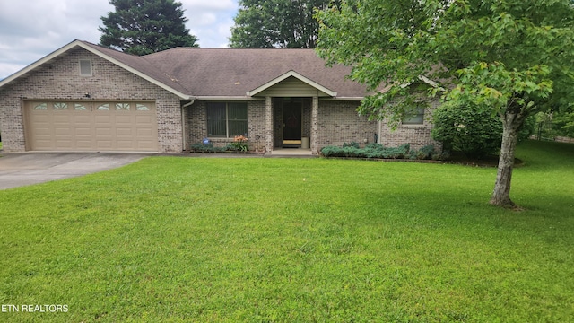 760 Gates Ln, Kodak, TN 37764 - single story home with brick siding, a garage, driveway, a front yard, and roof with shingles