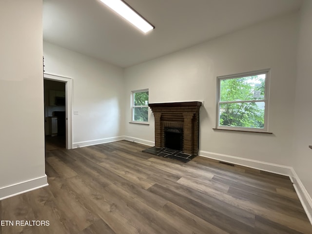 2634 Barton St, Knoxville, TN 37917 - unfurnished living room featuring baseboards, a fireplace, and dark wood finished floors