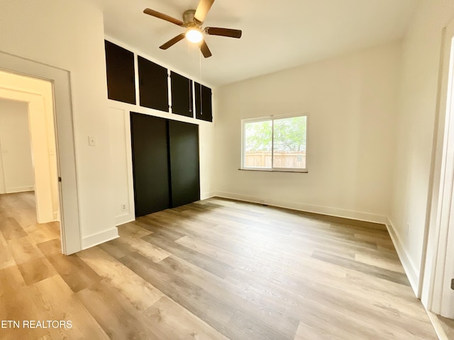 2634 Barton St, Knoxville, TN 37917 - unfurnished bedroom with light wood finished floors, a closet, baseboards, and a ceiling fan