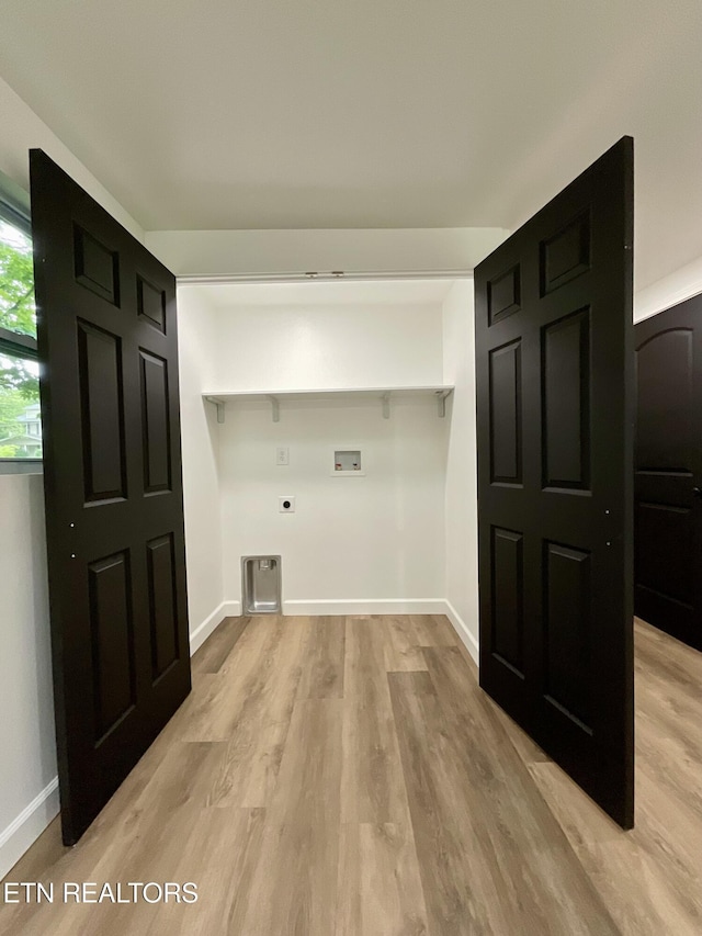 2634 Barton St, Knoxville, TN 37917 - laundry area with electric dryer hookup, hookup for a washing machine, light wood-style flooring, and baseboards
