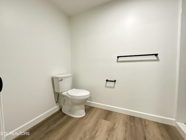 2634 Barton St, Knoxville, TN 37917 - bathroom with wood finished floors, baseboards, and toilet