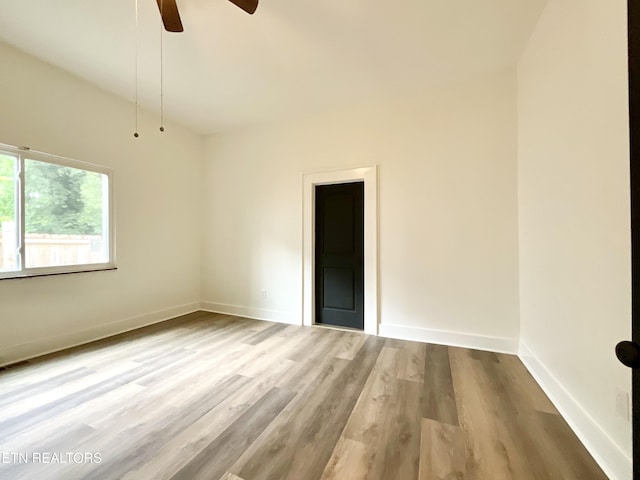 2634 Barton St, Knoxville, TN 37917 - unfurnished room with wood finished floors, ceiling fan, and baseboards
