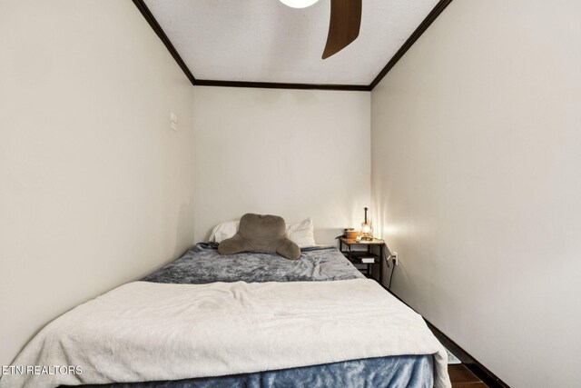 7901 Ewing Rd, Powell, TN 37849 - bedroom with crown molding, a ceiling fan, and wood finished floors
