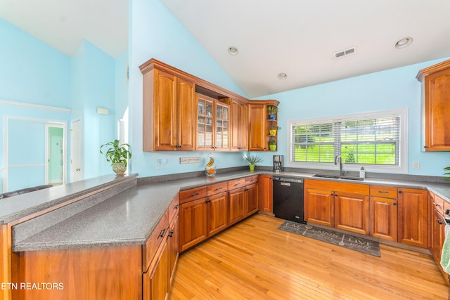 7924 Cedar Stone Ln, Powell, TN 37849 - kitchen with dishwasher, brown cabinetry, light wood-type flooring, a peninsula, and glass insert cabinets