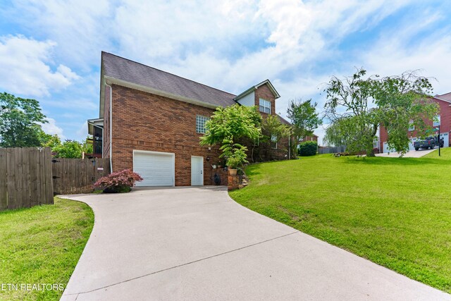 7924 Cedar Stone Ln, Powell, TN 37849 - view of property exterior with driveway, brick siding, and an attached garage