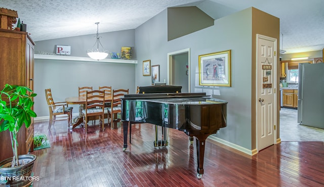 4512 Clairson Dr, Knoxville, TN 37931 - sitting room featuring vaulted ceiling, hardwood / wood-style floors, a textured ceiling, and baseboards