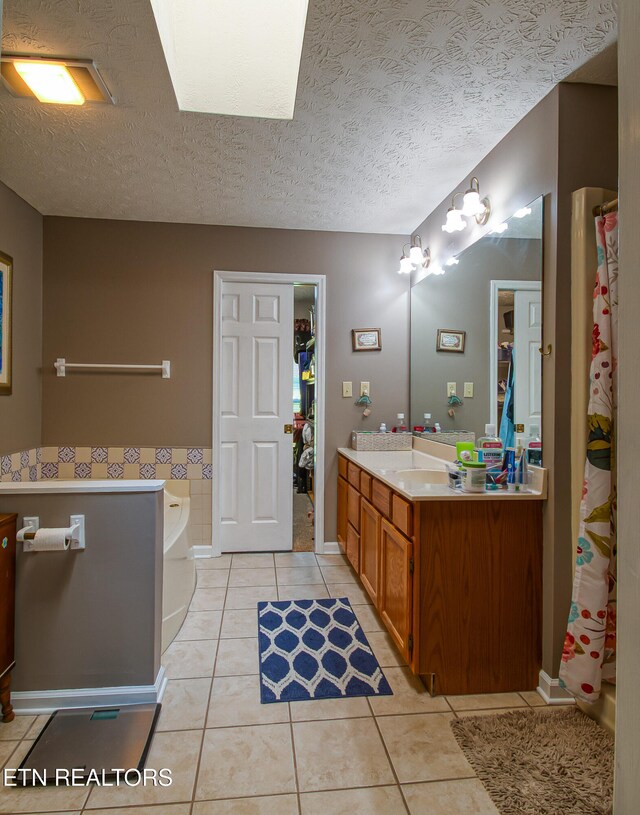 4512 Clairson Dr, Knoxville, TN 37931 - bathroom with tile patterned flooring, vanity, a textured ceiling, a bath, and a shower with curtain