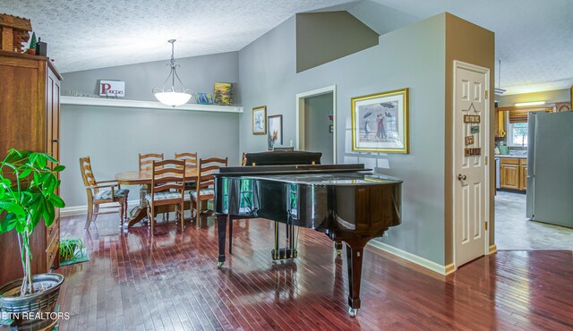 4512 Clairson Dr, Knoxville, TN 37931 - sitting room featuring vaulted ceiling, hardwood / wood-style floors, a textured ceiling, and baseboards