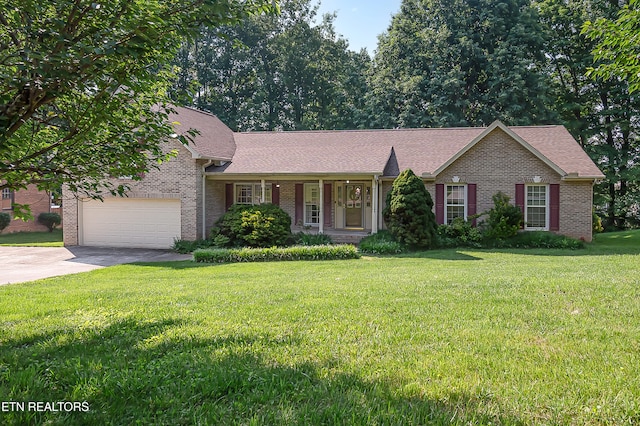4512 Clairson Dr, Knoxville, TN 37931 - view of front facade featuring brick siding, concrete driveway, an attached garage, a front yard, and covered porch