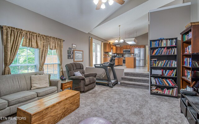 4512 Clairson Dr, Knoxville, TN 37931 - living room with light colored carpet, a ceiling fan, a chandelier, and high vaulted ceiling