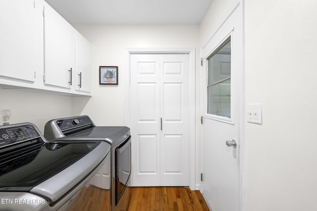 7339 Brookside Dr, Chattanooga, TN 37421 - laundry area with cabinet space, washer and clothes dryer, and wood finished floors