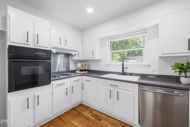 7339 Brookside Dr, Chattanooga, TN 37421 - kitchen with dishwasher, oven, a sink, electric stovetop, and under cabinet range hood