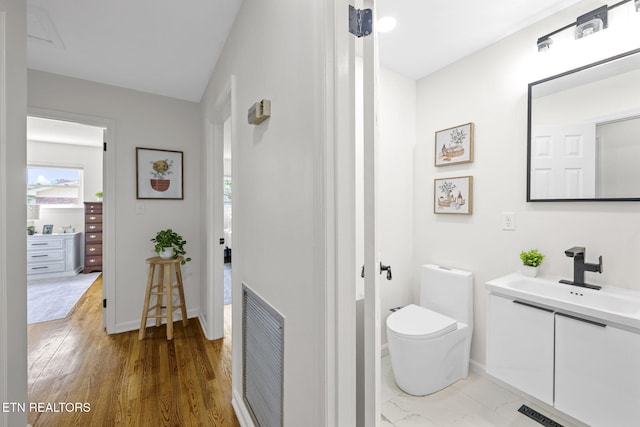 7339 Brookside Dr, Chattanooga, TN 37421 - bathroom featuring vanity, toilet, healthy amount of natural light, and baseboards