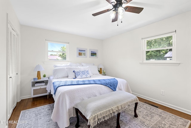 7339 Brookside Dr, Chattanooga, TN 37421 - bedroom featuring multiple windows, baseboards, wood finished floors, and a ceiling fan
