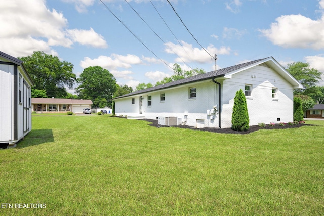 7339 Brookside Dr, Chattanooga, TN 37421 - rear view of property with a yard, cooling unit, and brick siding