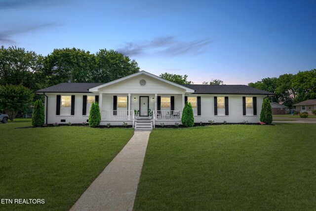 7339 Brookside Dr, Chattanooga, TN 37421 - single story home featuring a porch, a front yard, brick siding, and a shingled roof