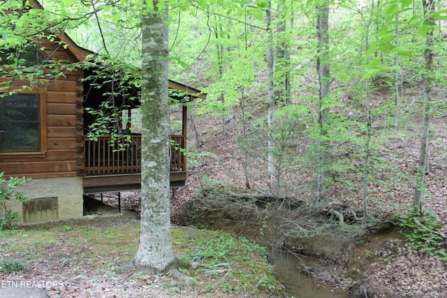 3006 Eagles Claw Way, Pigeon Forge, TN 37863 - view of yard with a deck and a view of trees