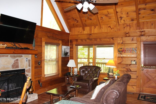 3006 Eagles Claw Way, Pigeon Forge, TN 37863 - living area with wood finished floors, wooden walls, ceiling fan, wood ceiling, and a stone fireplace