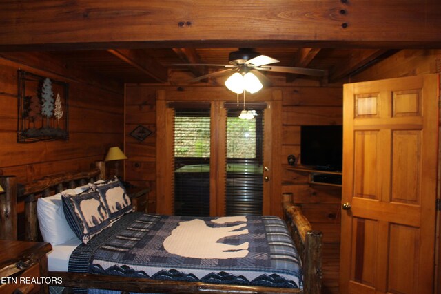 3006 Eagles Claw Way, Pigeon Forge, TN 37863 - bedroom with wooden walls and wooden ceiling with exposed beams