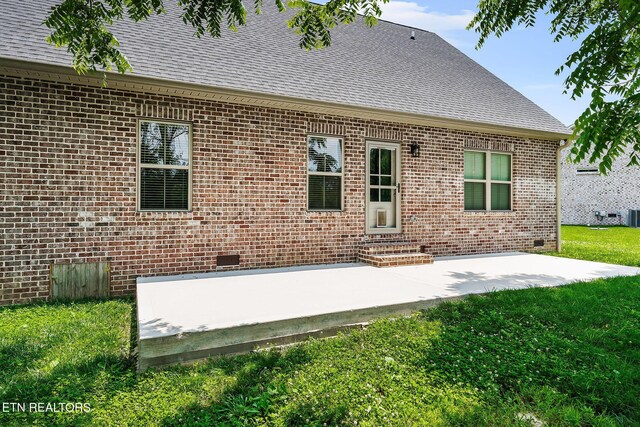 20 Cabot Ln, Cookeville, TN 38506 - rear view of property featuring brick siding, roof with shingles, a patio area, and a yard