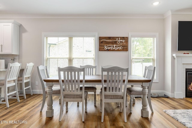 20 Cabot Ln, Cookeville, TN 38506 - dining space featuring crown molding, light wood-style flooring, a fireplace, baseboards, and recessed lighting