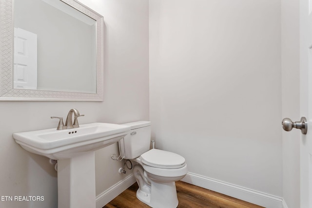 20 Cabot Ln, Cookeville, TN 38506 - half bath featuring wood finished floors, toilet, baseboards, and a sink