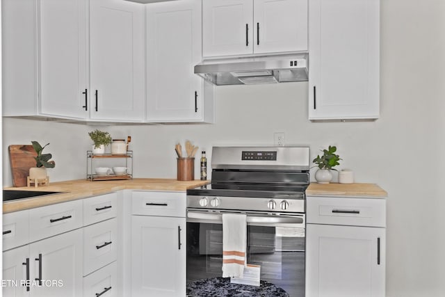 340 Gilbert St, Morristown, TN 37814 - kitchen featuring range hood, stainless steel electric range oven, and white cabinetry