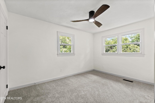 340 Gilbert St, Morristown, TN 37814 - carpeted empty room featuring healthy amount of natural light, baseboards, and a ceiling fan