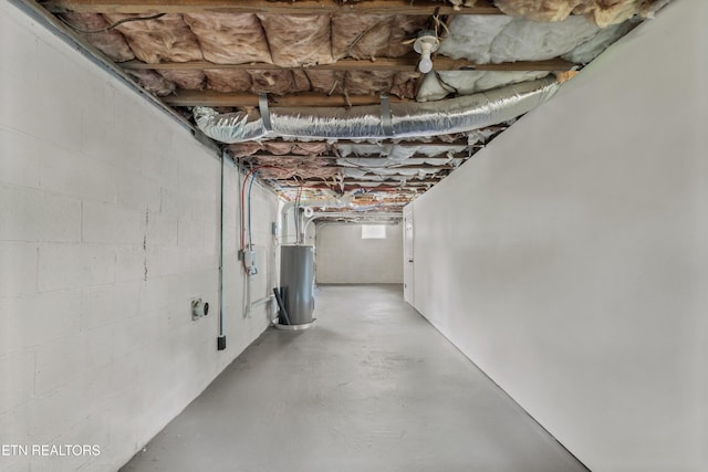 340 Gilbert St, Morristown, TN 37814 - unfinished basement featuring water heater and concrete block wall
