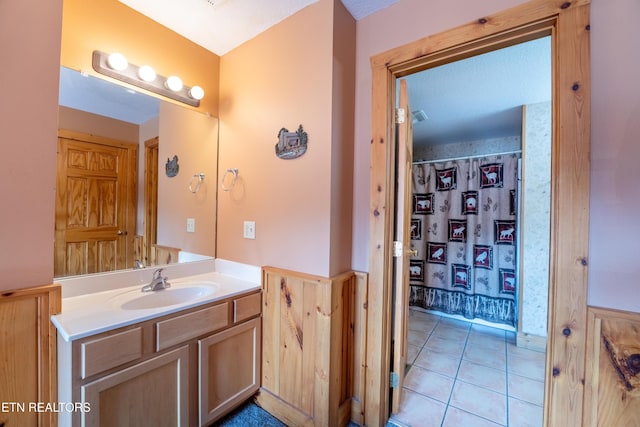 407 Big Bear Way, Pigeon Forge, TN 37863 - bathroom featuring vanity, wainscoting, tile patterned flooring, and curtained shower