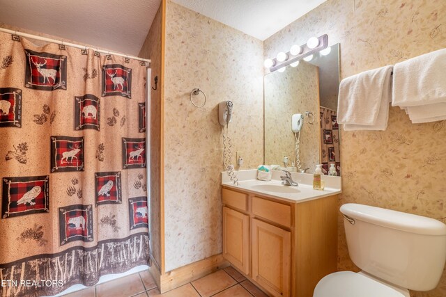 407 Big Bear Way, Pigeon Forge, TN 37863 - bathroom with tile patterned flooring, vanity, toilet, a shower with shower curtain, and wallpapered walls