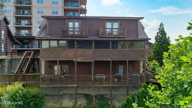 407 Big Bear Way, Pigeon Forge, TN 37863 - rear view of property featuring a balcony, stairway, a sunroom, and faux log siding