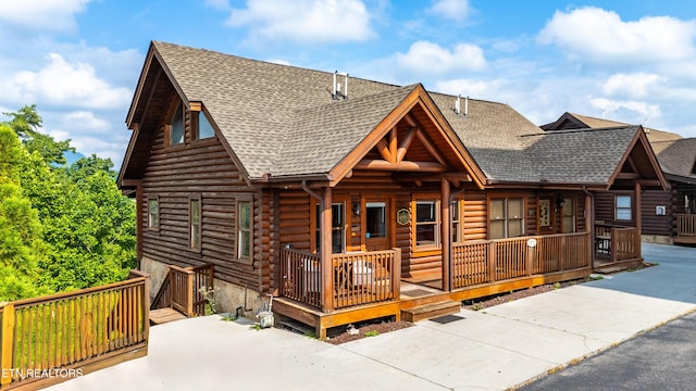 407 Big Bear Way, Pigeon Forge, TN 37863 - cabin featuring roof with shingles, covered porch, and log siding