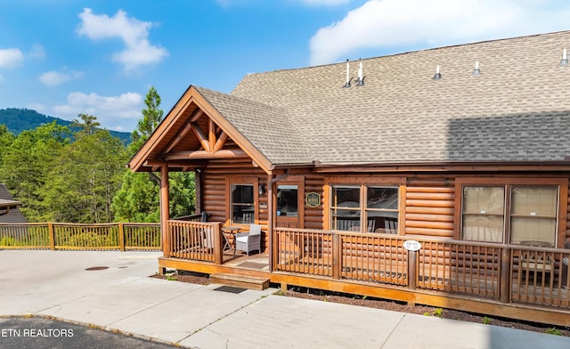407 Big Bear Way, Pigeon Forge, TN 37863 - view of front of home featuring roof with shingles, a wooden deck, and faux log siding