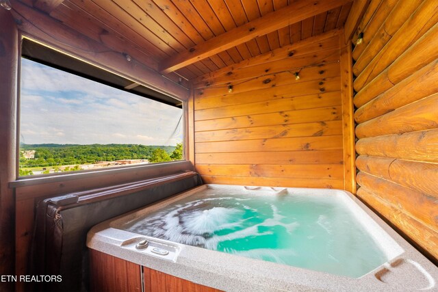 407 Big Bear Way, Pigeon Forge, TN 37863 - misc room with a jacuzzi, wooden ceiling with exposed beams, and wooden walls