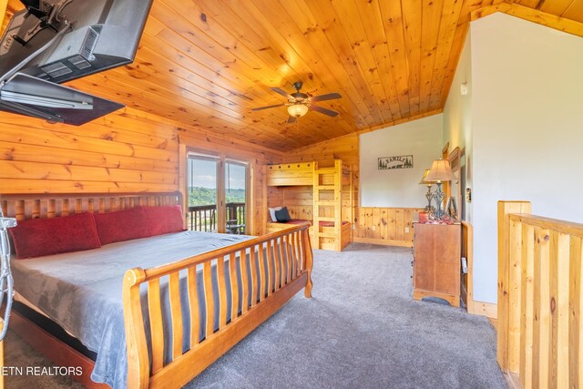407 Big Bear Way, Pigeon Forge, TN 37863 - carpeted bedroom featuring wood walls, wooden ceiling, vaulted ceiling, access to outside, and wainscoting