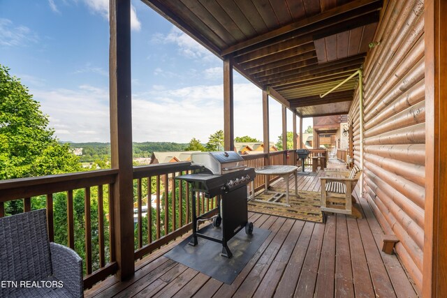 407 Big Bear Way, Pigeon Forge, TN 37863 - wooden deck with grilling area and outdoor dining space