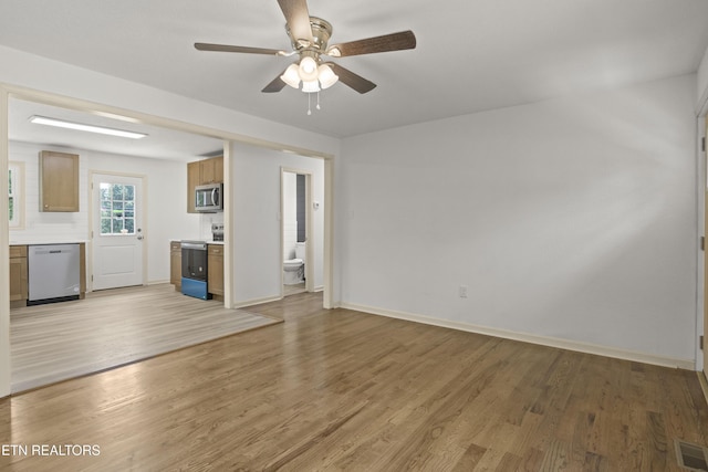 508 E Oldham Ave, Knoxville, TN 37917 - unfurnished living room featuring light wood-style flooring, a ceiling fan, and baseboards
