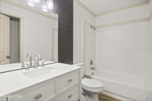 508 E Oldham Ave, Knoxville, TN 37917 - bathroom featuring ornamental molding, toilet, vanity, shower / tub combination, and wood finished floors