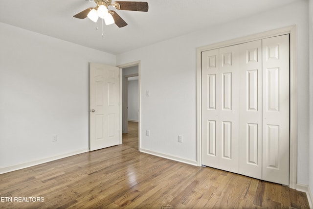 508 E Oldham Ave, Knoxville, TN 37917 - unfurnished bedroom featuring wood finished floors, baseboards, a closet, and ceiling fan