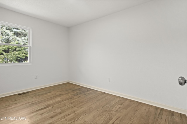 508 E Oldham Ave, Knoxville, TN 37917 - empty room featuring wood finished floors and baseboards